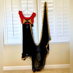 Black pure chiffon light weight saree with red stones all over & red blouse